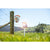 sunlight charging the Gallagher S30 Lithium Solar Electric Fence Energizer while connected to livestock fence